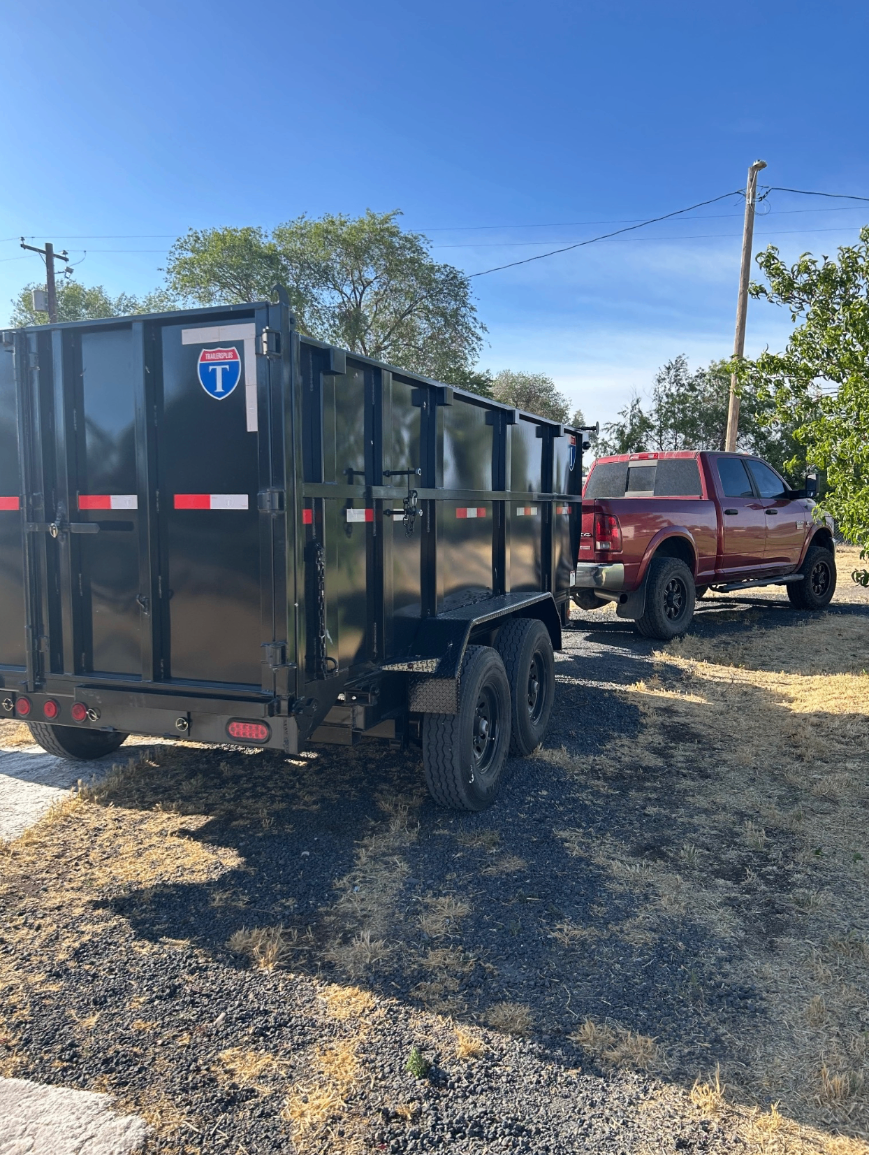 ProHaul dump trailer hitched to truck ready for junk removal